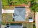 An aerial view shows a cozy single-story home with a long driveway and backyard storage shed at 5195 Sw 128Th Street Rd, Ocala, FL 34473