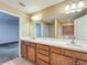 Bathroom featuring double sinks and a large mirror at 5195 Sw 128Th Street Rd, Ocala, FL 34473