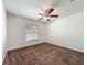 Standard bedroom featuring a ceiling fan and a window with blinds at 5195 Sw 128Th Street Rd, Ocala, FL 34473