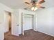 Cozy bedroom featuring a ceiling fan and a closet with bi-fold doors at 5195 Sw 128Th Street Rd, Ocala, FL 34473