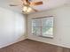 This bedroom has carpeting and a window with wood blinds at 5195 Sw 128Th Street Rd, Ocala, FL 34473