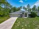 Inviting single-story home with a well-maintained lawn and a cozy front entrance at 5195 Sw 128Th Street Rd, Ocala, FL 34473