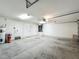 Spacious garage featuring a white door, with room for parking and storage, plus a water heater on the left at 5195 Sw 128Th Street Rd, Ocala, FL 34473