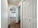 Hallway with an arched doorway leading to another living space at 5195 Sw 128Th Street Rd, Ocala, FL 34473