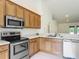 This kitchen features stainless steel appliances, recessed lights, and tile flooring at 5195 Sw 128Th Street Rd, Ocala, FL 34473