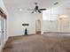 Spacious living room with carpeting, ceiling fan, and French doors to the outside at 5195 Sw 128Th Street Rd, Ocala, FL 34473