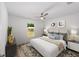 Bright bedroom featuring modern decor, ceiling fan, and ample natural light at 5389 Nw 65Th St, Ocala, FL 34482