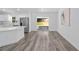Bright space with hardwood floors, an open-concept kitchen, and sliding door access at 5389 Nw 65Th St, Ocala, FL 34482