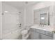 The bathroom offers a white vanity, a tiled floor, and a shower-tub combination at 5894 Sw 77Th Ct, Ocala, FL 34481
