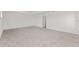 The bedroom has neutral carpet, base molding, white walls and a standard closet at 5894 Sw 77Th Ct, Ocala, FL 34481