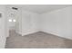Bedroom boasts neutral carpet and light walls with a closet and interior door at 5894 Sw 77Th Ct, Ocala, FL 34481