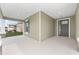 Spacious front porch with green siding at 5894 Sw 77Th Ct, Ocala, FL 34481