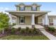 Welcoming front porch with stone accents, columns and landscaping at 5894 Sw 77Th Ct, Ocala, FL 34481