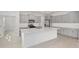 Modern kitchen featuring gray cabinets, stainless steel appliances, and a large center island at 5894 Sw 77Th Ct, Ocala, FL 34481