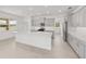 Stylish kitchen with gray cabinetry, stainless steel appliances, and a large island at 5894 Sw 77Th Ct, Ocala, FL 34481