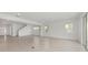 Open-concept living area with a staircase and tiled floors, perfect for modern living at 5894 Sw 77Th Ct, Ocala, FL 34481