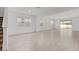Open living room with tile flooring and natural light at 5894 Sw 77Th Ct, Ocala, FL 34481