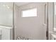 Shower featuring white subway tile, a small window and a tile mosaic shower floor at 5894 Sw 77Th Ct, Ocala, FL 34481