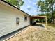 Exterior featuring the backyard with an outdoor covered patio area at 6134 Se Stetson Rd, Belleview, FL 34420