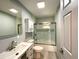 A recently updated bathroom featuring shower-tub combo and modern vanity at 6134 Se Stetson Rd, Belleview, FL 34420