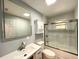 A recently updated bathroom featuring shower-tub combo and modern vanity at 6134 Se Stetson Rd, Belleview, FL 34420
