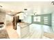 Updated kitchen featuring stainless steel appliances, granite countertops, and an open living area at 6134 Se Stetson Rd, Belleview, FL 34420