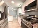 Gourmet kitchen with stainless appliances, granite countertops, island, and custom cabinetry at 6134 Se Stetson Rd, Belleview, FL 34420