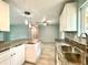 An inviting kitchen with granite countertops and stainless steel sink at 6134 Se Stetson Rd, Belleview, FL 34420