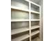 Pantry with shelving storage for organization and ample room for food at 6134 Se Stetson Rd, Belleview, FL 34420