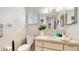 Bright bathroom with vanity, drawers, flowers and toilet at 6468 Sw 107Th Pl, Ocala, FL 34476