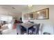 Open-concept living and dining area with contemporary furnishings and plenty of natural light at 6468 Sw 107Th Pl, Ocala, FL 34476