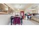 Charming kitchen and dining area with modern appliances, a cozy dining table, and ample counter space at 6468 Sw 107Th Pl, Ocala, FL 34476