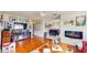 Spacious living room with wood floors, tv, fireplace, and comfortable seating area at 6468 Sw 107Th Pl, Ocala, FL 34476