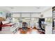 Bright office space with multiple workstations and natural light from large windows at 6468 Sw 107Th Pl, Ocala, FL 34476