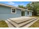 A view of the backyard and the patio area, which offers a great spot for outdoor entertainment and relaxation at 7299 Sw 202 Ct, Dunnellon, FL 34431