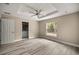 Serene bedroom featuring neutral colors, a large window, and wood-look floors at 7299 Sw 202 Ct, Dunnellon, FL 34431