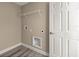 A well lit laundry room with hookups and shelving for storage at 7299 Sw 202 Ct, Dunnellon, FL 34431