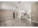 A stylish living room flows into a modern kitchen with sleek countertops and an island at 7299 Sw 202 Ct, Dunnellon, FL 34431