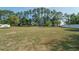 Expansive backyard with mature trees and white fencing, providing privacy and plenty of space at 7475 Se 105Th Pl, Belleview, FL 34420