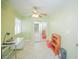 Cozy bedroom with neutral walls, ceiling fan, and mirrored closet, ideal for a home office at 7475 Se 105Th Pl, Belleview, FL 34420