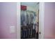 Walk-in closet with hanging storage, shelves, and lots of room for clothes and accessories at 7475 Se 105Th Pl, Belleview, FL 34420