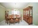 Formal dining room with elegant chandelier, ornate china cabinet, and set table at 7475 Se 105Th Pl, Belleview, FL 34420