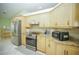 Modern kitchen featuring stainless steel appliances, and ample storage at 7475 Se 105Th Pl, Belleview, FL 34420