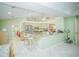 Open-concept kitchen with a breakfast bar overlooking the living area, great for entertaining at 7475 Se 105Th Pl, Belleview, FL 34420