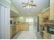 Bright kitchen with stainless steel appliances, ample counter space, and a breakfast bar at 7475 Se 105Th Pl, Belleview, FL 34420