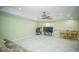 Spacious open-concept living area with tile flooring, vaulted ceilings, and seamless flow to kitchen and dining at 7475 Se 105Th Pl, Belleview, FL 34420
