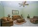 Inviting living room featuring tile floors, ceiling fan, and a vaulted ceiling at 7475 Se 105Th Pl, Belleview, FL 34420