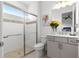 Bright bathroom with modern gray vanity, a framed mirror, walk-in shower, and tile flooring at 8111 Sw 95Th Ct, Ocala, FL 34481