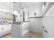 Bright bathroom featuring granite countertops, a glass shower, a seat, and handicap support bars at 8111 Sw 95Th Ct, Ocala, FL 34481