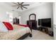 Primary bedroom features ceiling fan and view into Primary bath at 8111 Sw 95Th Ct, Ocala, FL 34481